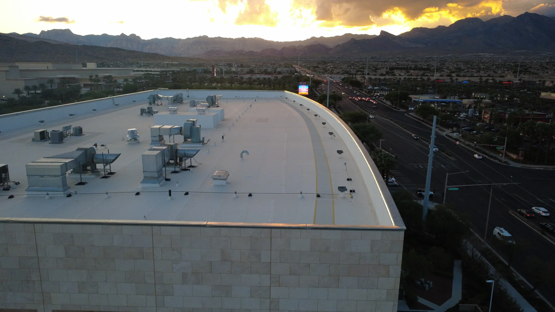 Large flat roof with rows of HVAC units at sunset, Las Vegas