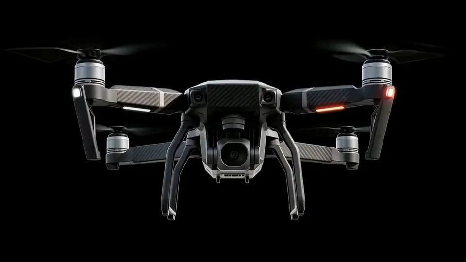 Drone hovering against a black background