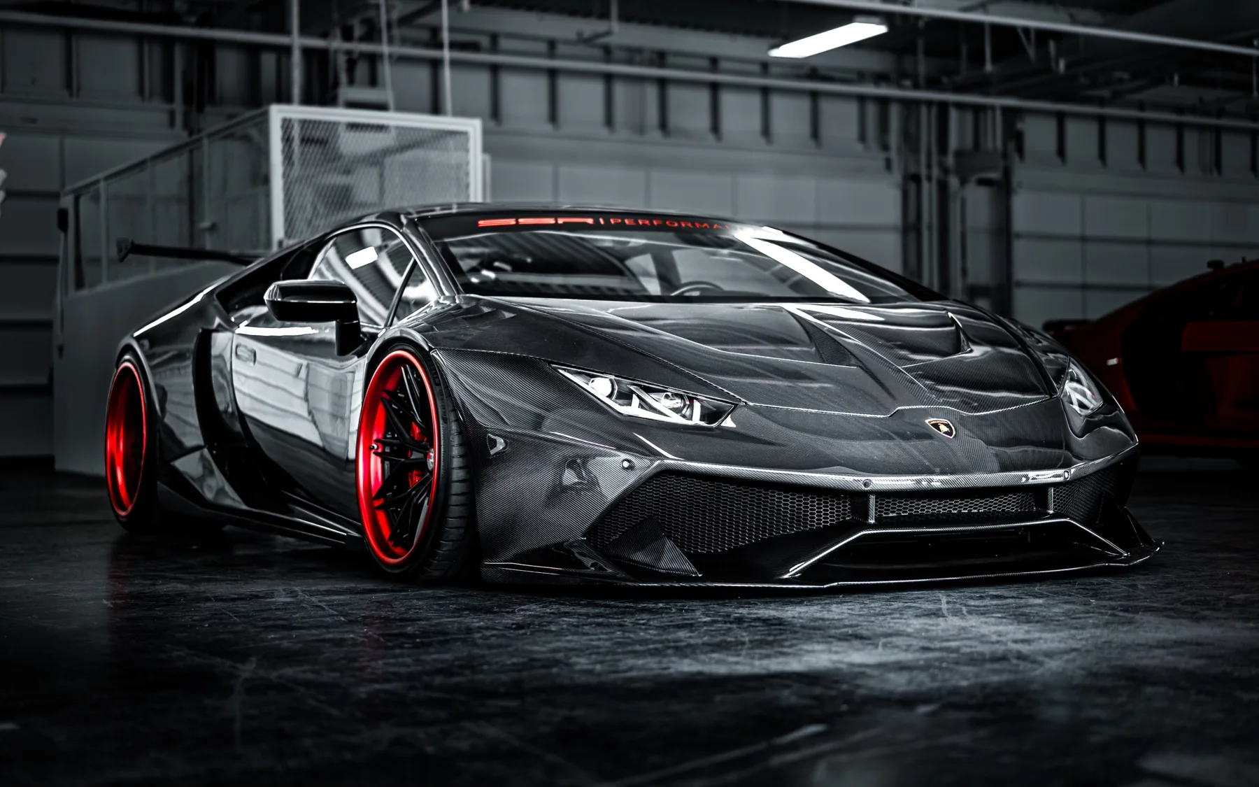 Black supercar in a photo studio